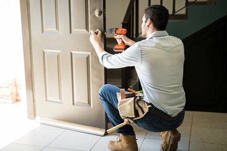 handyman fixing door locks